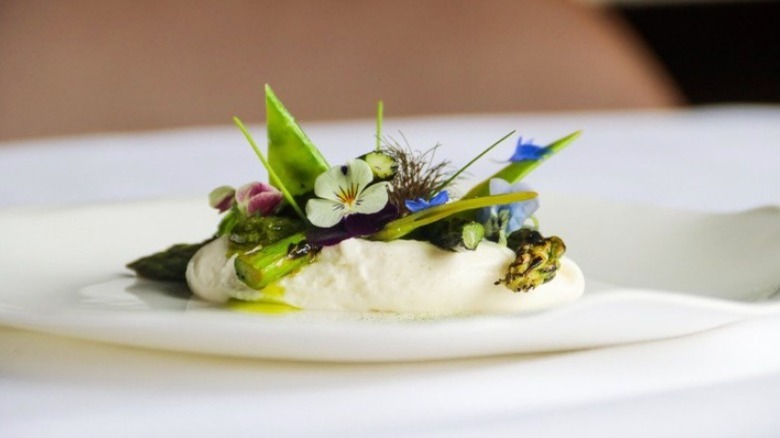 Whipped burrata with edible flowers