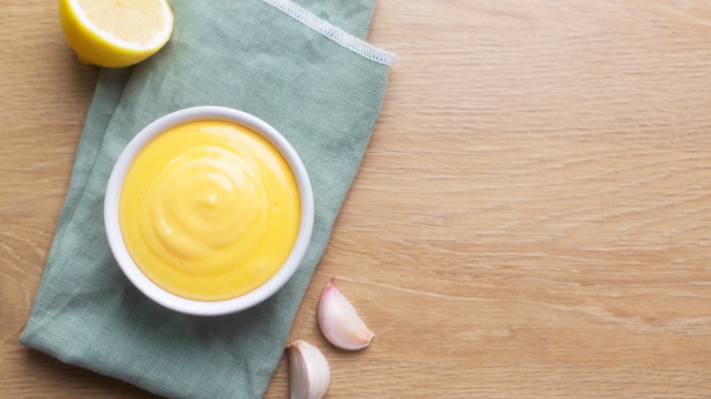 Bright yellow aioli on a napkin