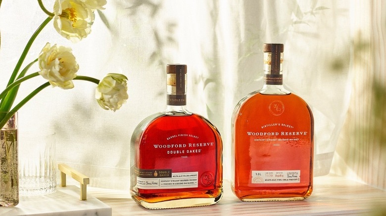 Woodford Reserve bourbon bottles sunlight