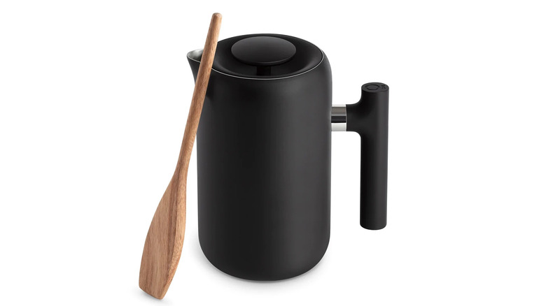 Black french press and wood spoon