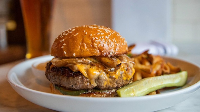 Cheeseburger with fries and pickle