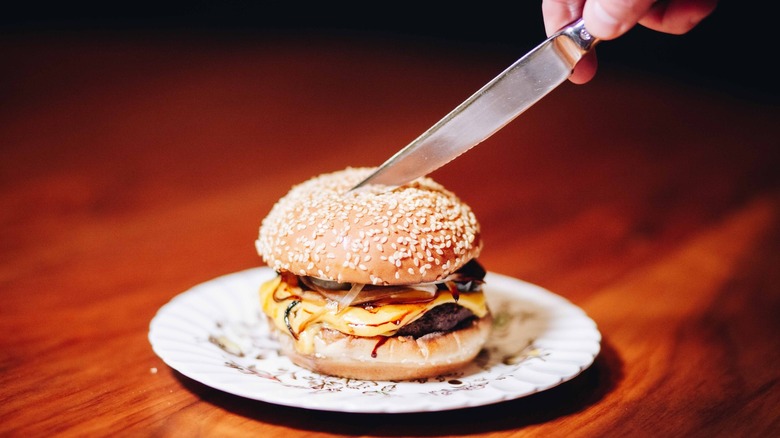 Burger with onions and sesame seed bun