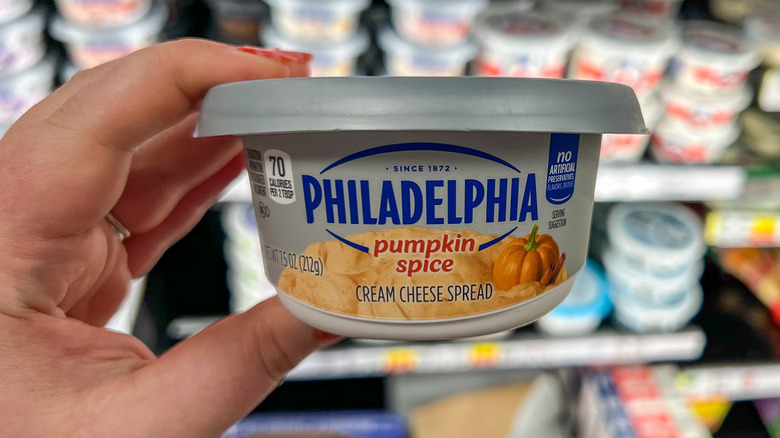 handheld Philadelphia Cream Cheese container