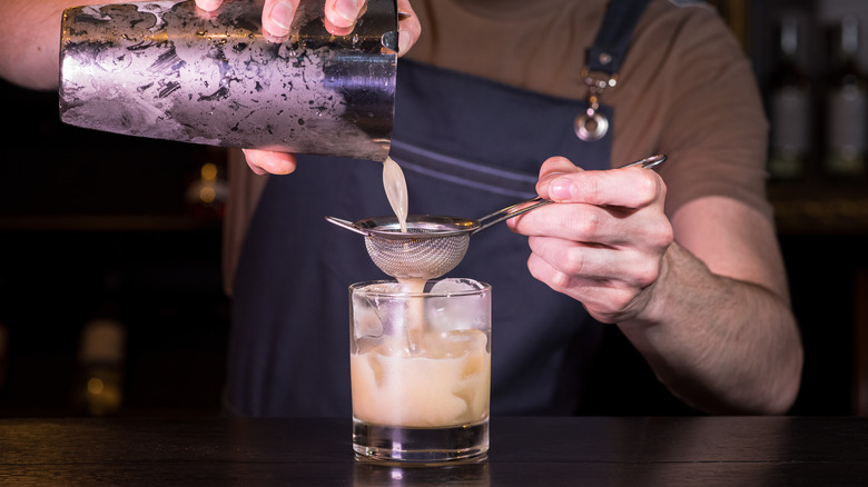 whiskey sour with cocktail tools