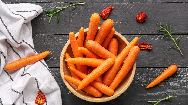 carrots in a bowl on a wood table