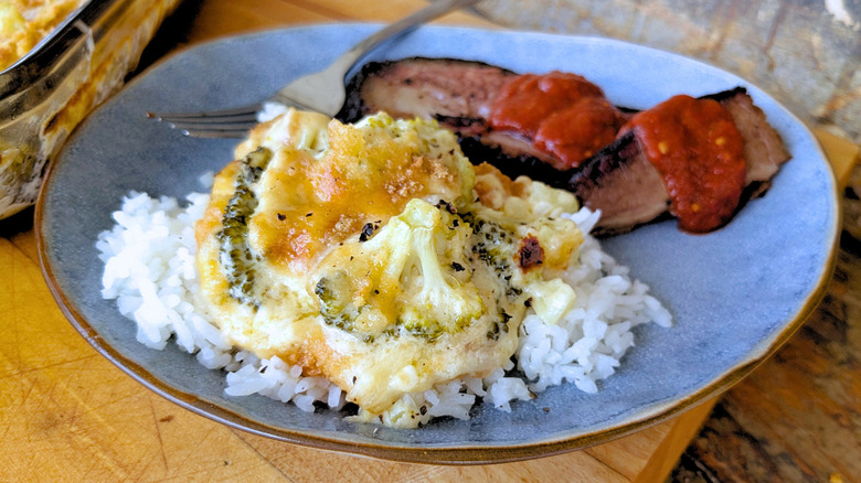 Plated broccoli casserole with rice and brisket