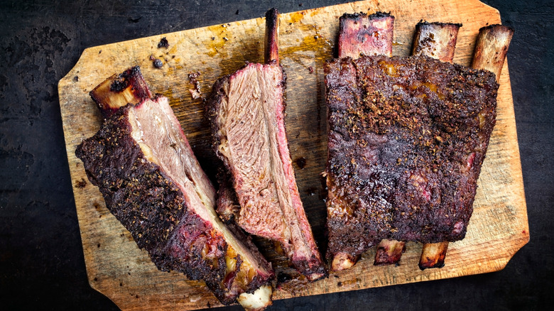 Chuck short ribs on a wooden board