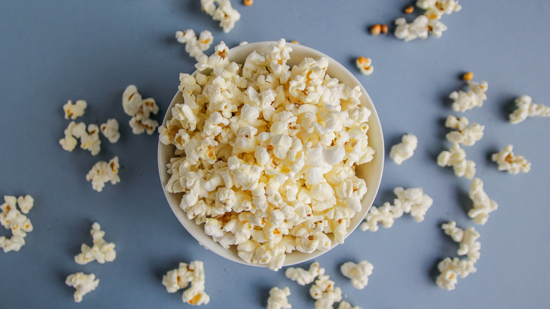 popcorn bowl on blue background