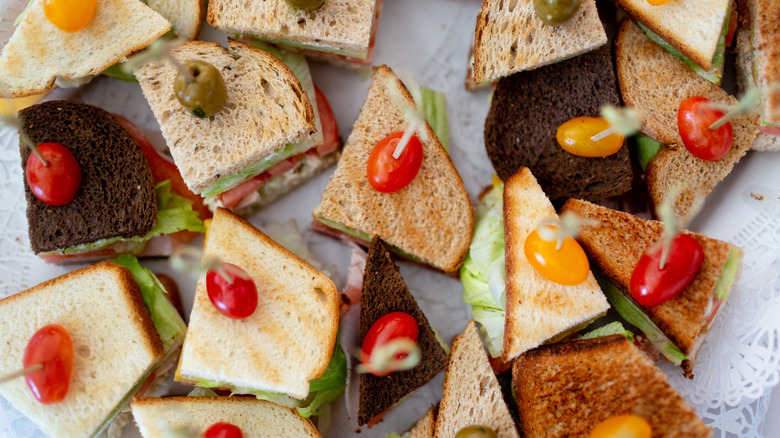 birds eye view of different types of sandwiches cut into triangles