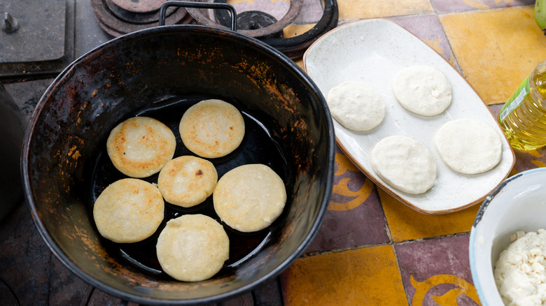 raw and cooked arepas