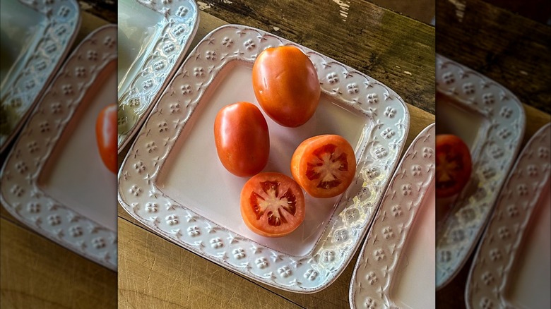 breaker tomatoes on a white plate