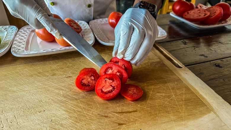 red tomato being sliced