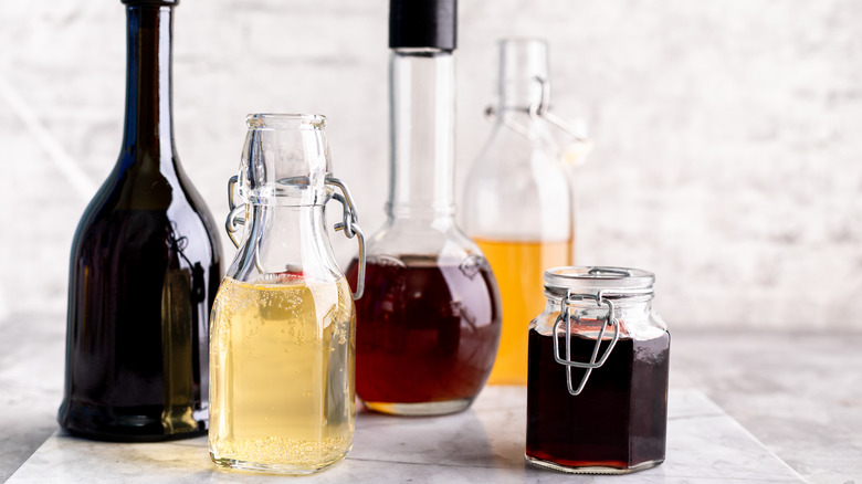 glass bottles filled with vinegar