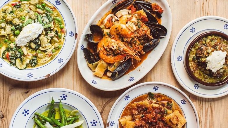 Various pasta on white plates