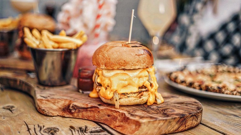 Cheese burger on wooden slab