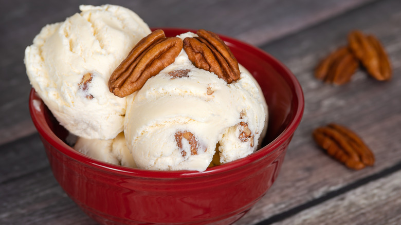 Pecan ice cream in red bowl