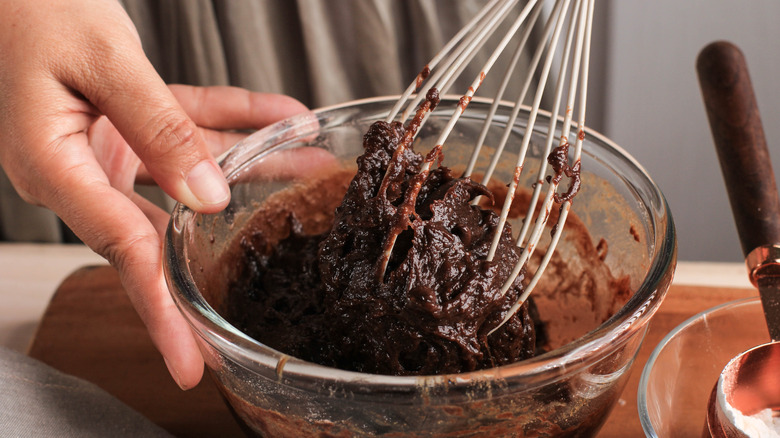 Mixing brownie batter with whisk