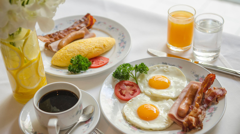 Eggs with bacon, sausage, and ham
