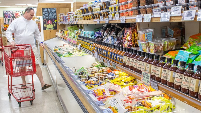 A shopper in the frozen food aisle at Trader Joe's