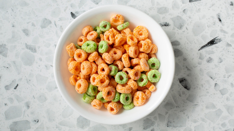 apple jacks in white bowl and milk