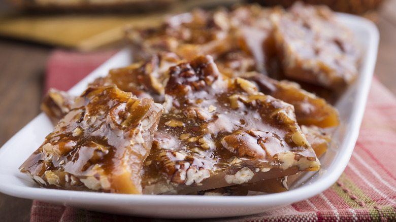 mixed nut brittle on a plate