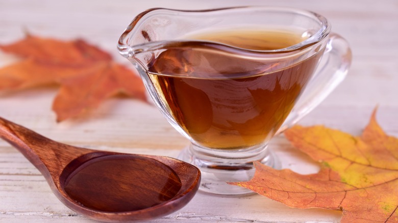 A pitcher and spoonful of Amber maple syrup