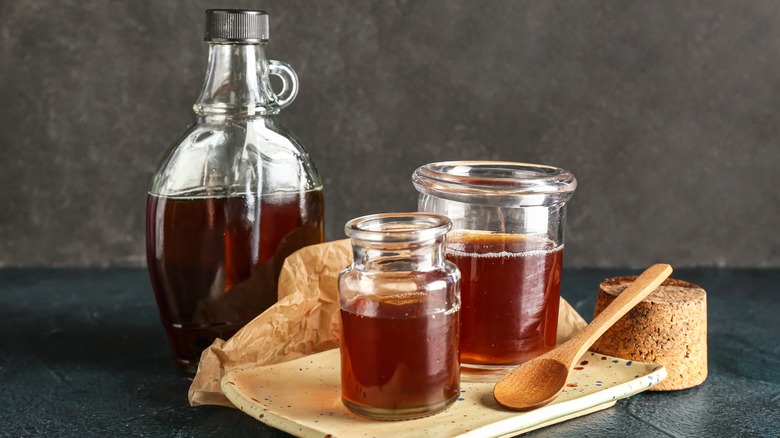 A bottle and jars of Dark maple syrup