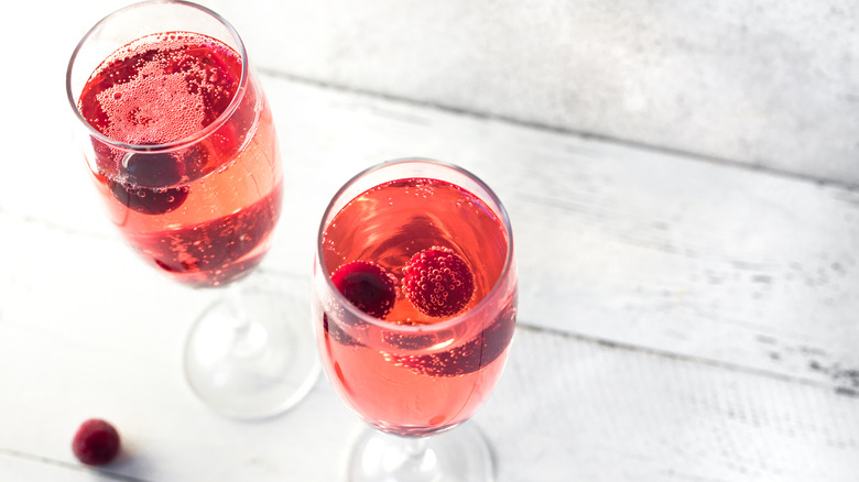 Raspberry-topped Kir Royale cocktails