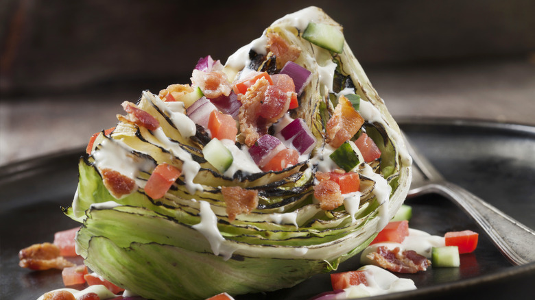 A wedge salad on a plate