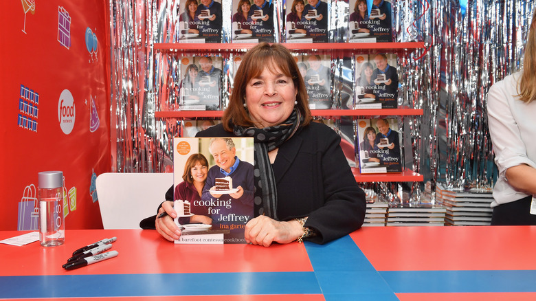 Ina Garten holding cookbook