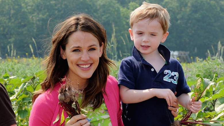 Jennifer Garner picking vegetables with her son