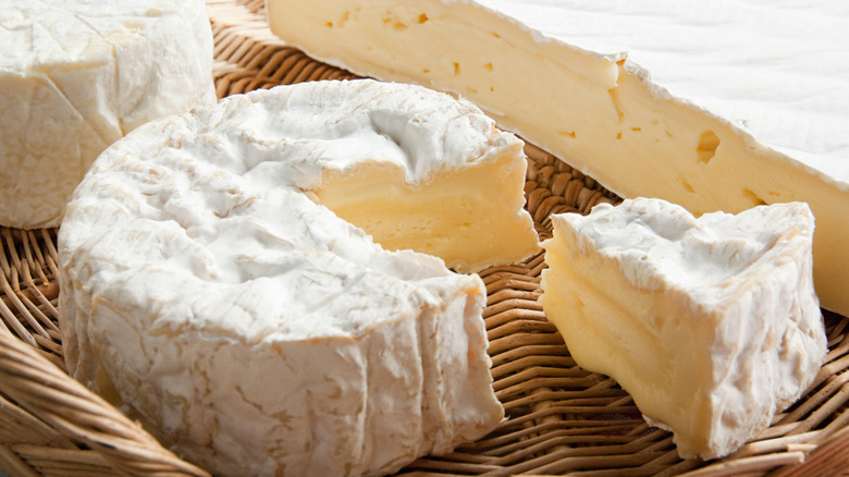 French brie wheel with slice cut out