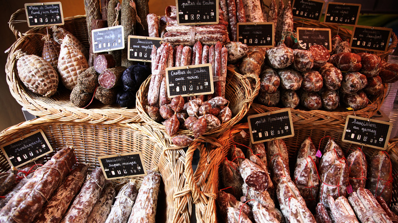 French cured sausages on display at a market