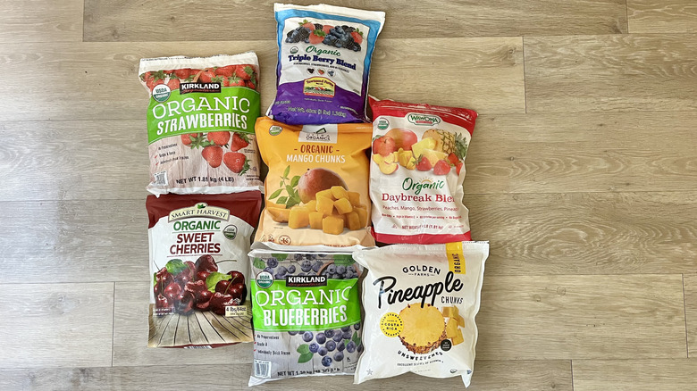 Bags of Costco frozen fruits on wooden background