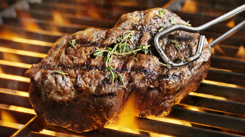 sirloin filet grilling with tongs