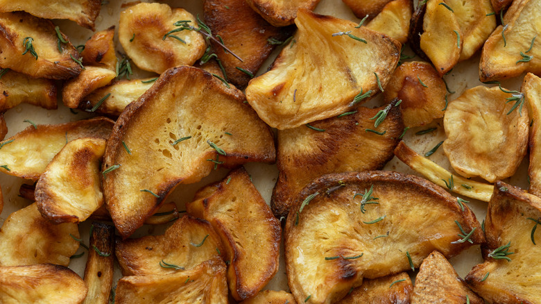 Parsnip chips seasoned with thyme leaves