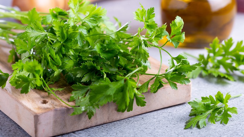 fresh parsley on cutting board