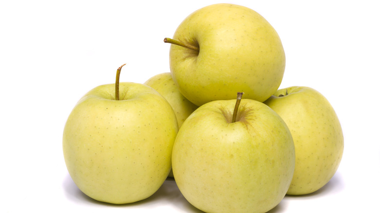 Ginger Gold apples on white background