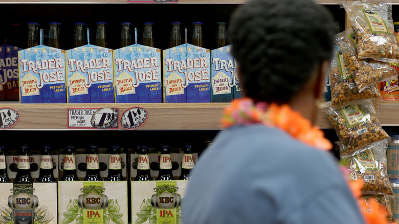 Person walking by beer at Trader Joe's