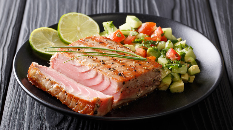 plate of grilled tuna with salsa on the side