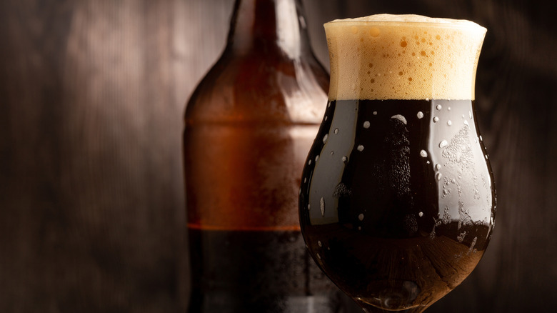 Brown porter in dark, rustic setting