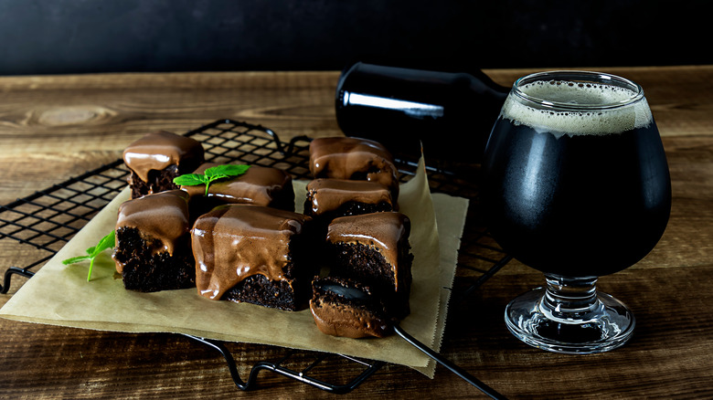 Brownies next to a glass of stout