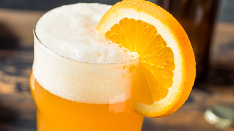 Wheat beer with orange garnish