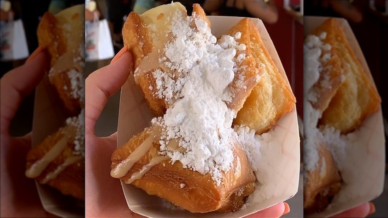 Paper basket of praline beignets