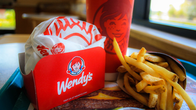 The hamburger, fries and a Wendy drink