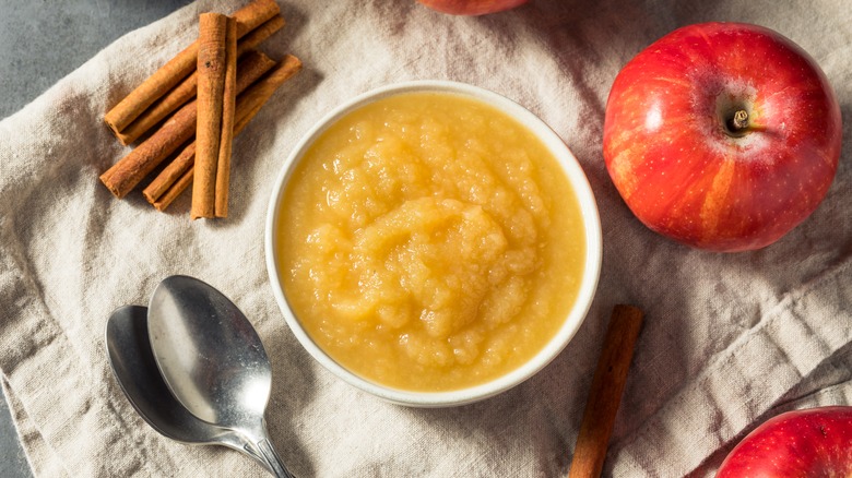 Bowl of applesauce with spoons 