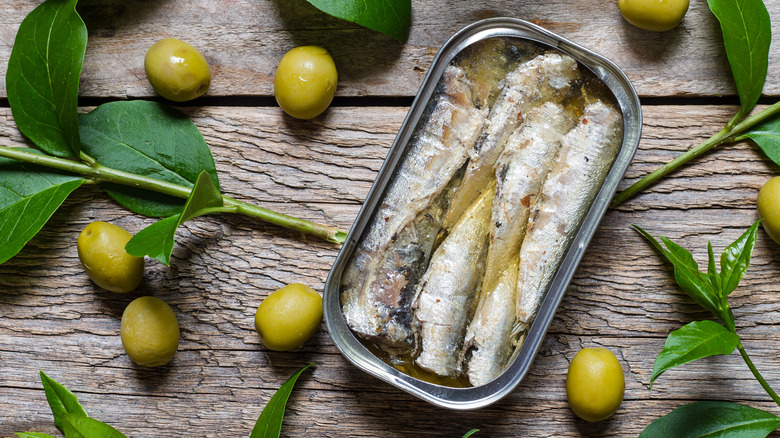 Open can sardines in olive oil