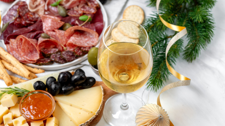 White wine with meat and cheese spread