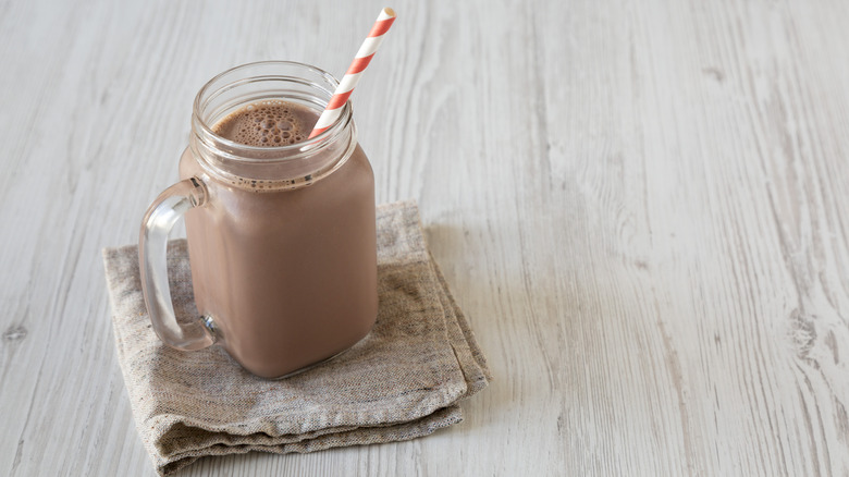 Jar of chocolate milk, with straw