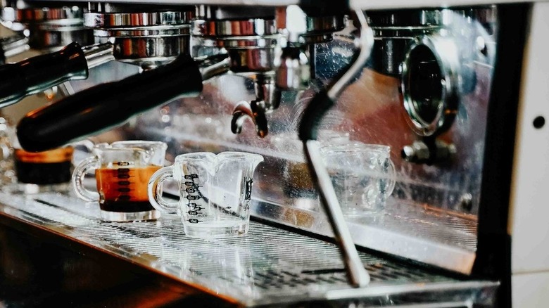 Coffee measuring cups on a machine